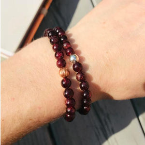 garnet beaded bracelet with 6mm beads and a silver focal bead